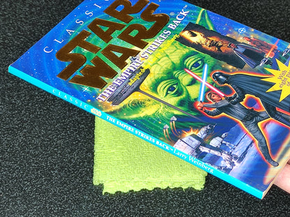 Star Wars trading card with a green cleaning cloth on a dark surface