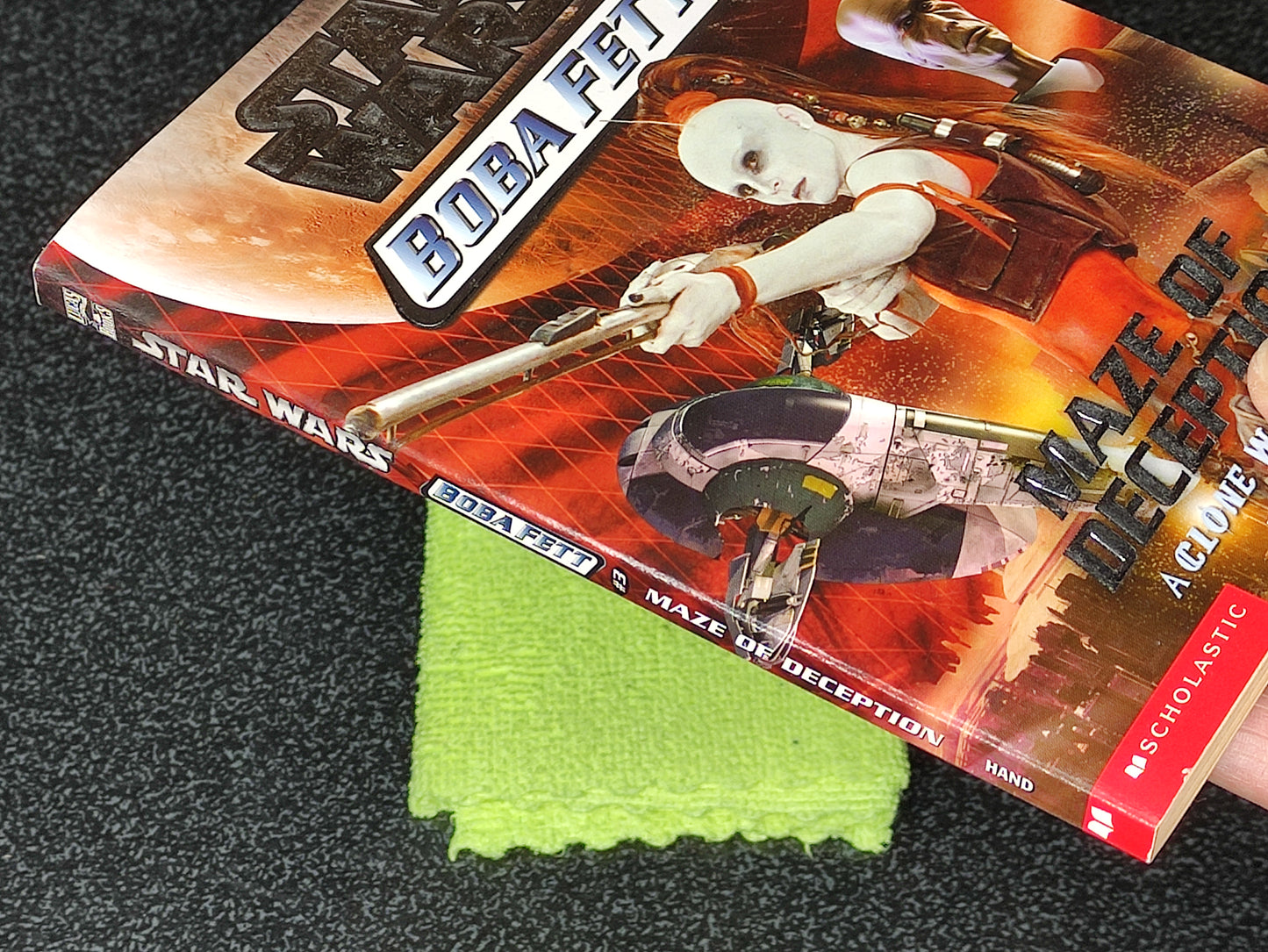 Star Wars Buba Fett book with a green cloth on a textured surface