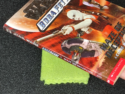 Star Wars Buba Fett book with a green cloth on a textured surface