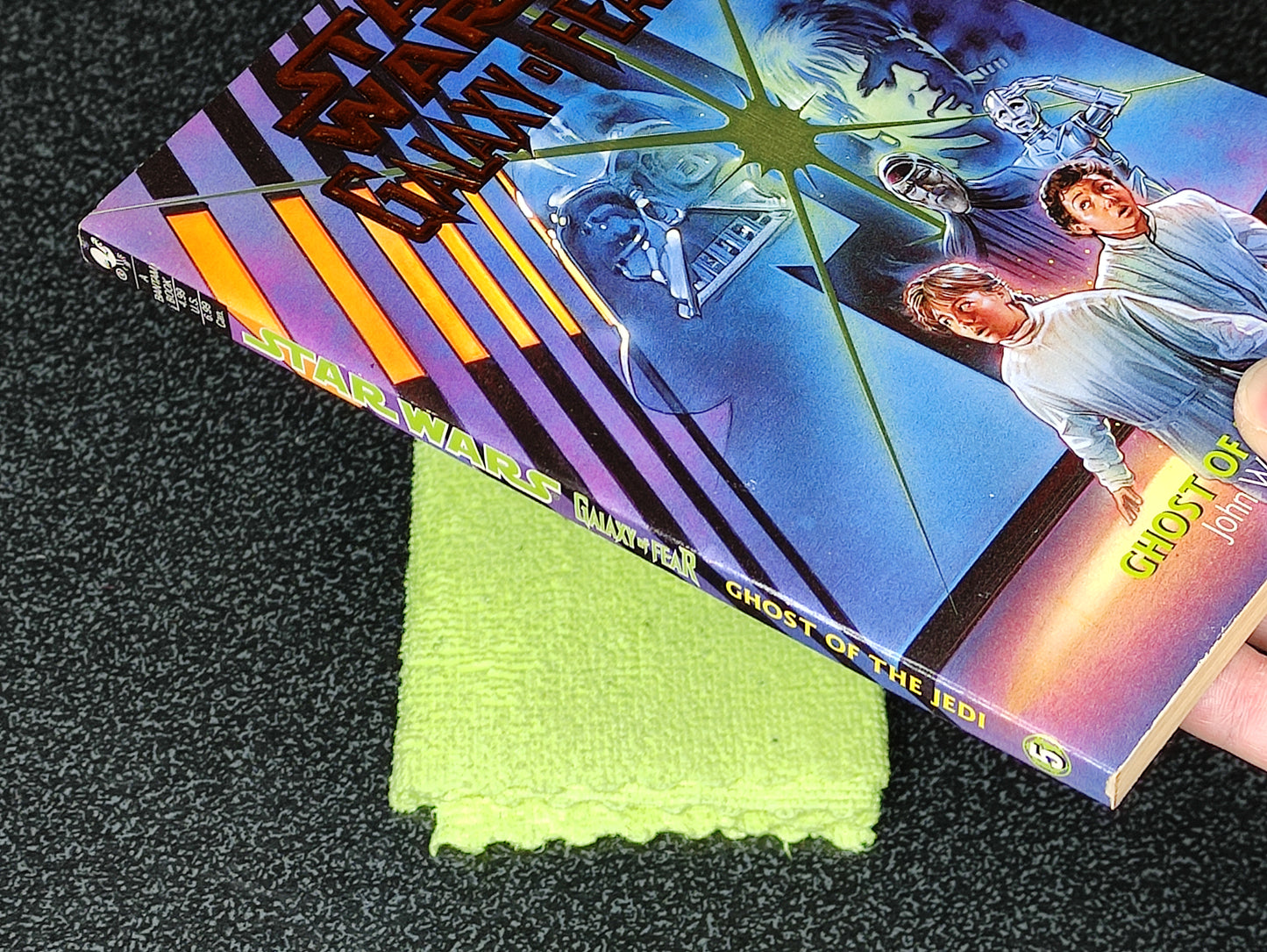 Star Wars Book with a green cloth on a dark surface