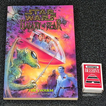 Star Wars book titled 'Galaxy of Fear' by John Whitman on a textured black surface with a small box labeled 'Beehive'.