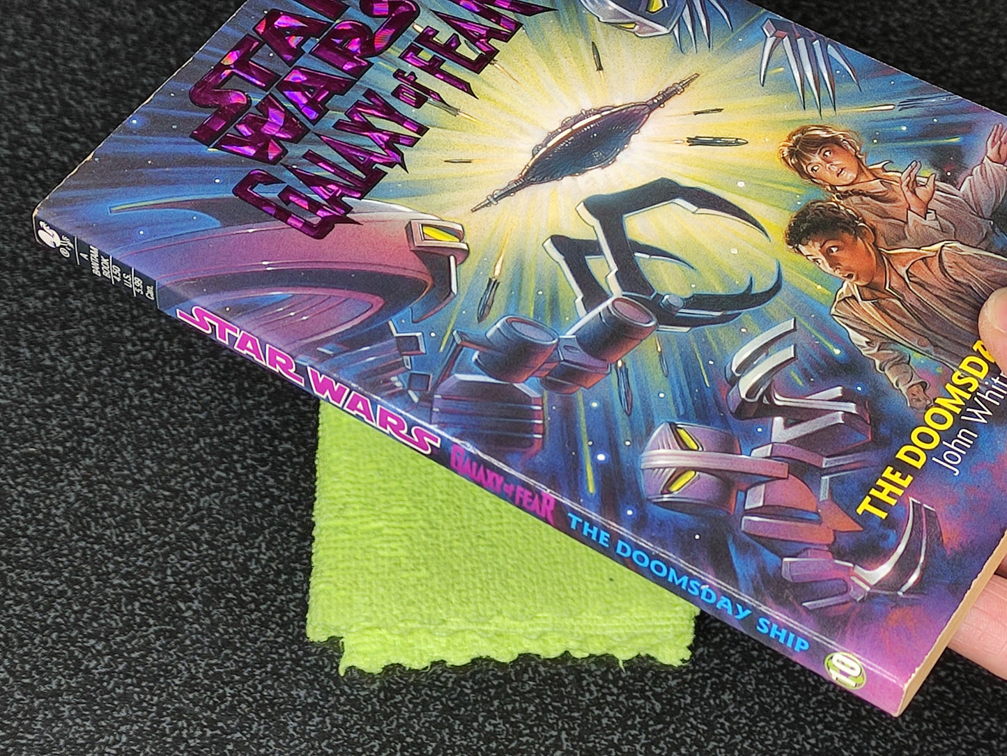 Star Wars book titled 'The Doomsday Ship' on a textured surface with a green cloth underneath.