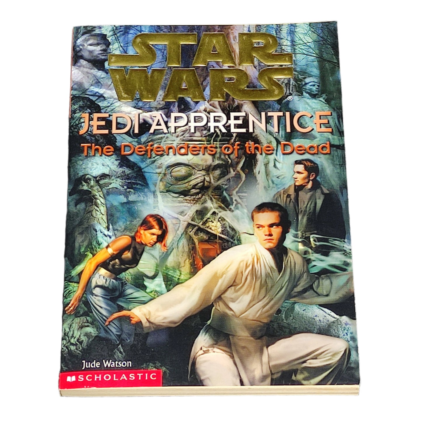 Book titled 'Star Wars Jedi Apprentice: The Defenders of the Dead' on a textured black background