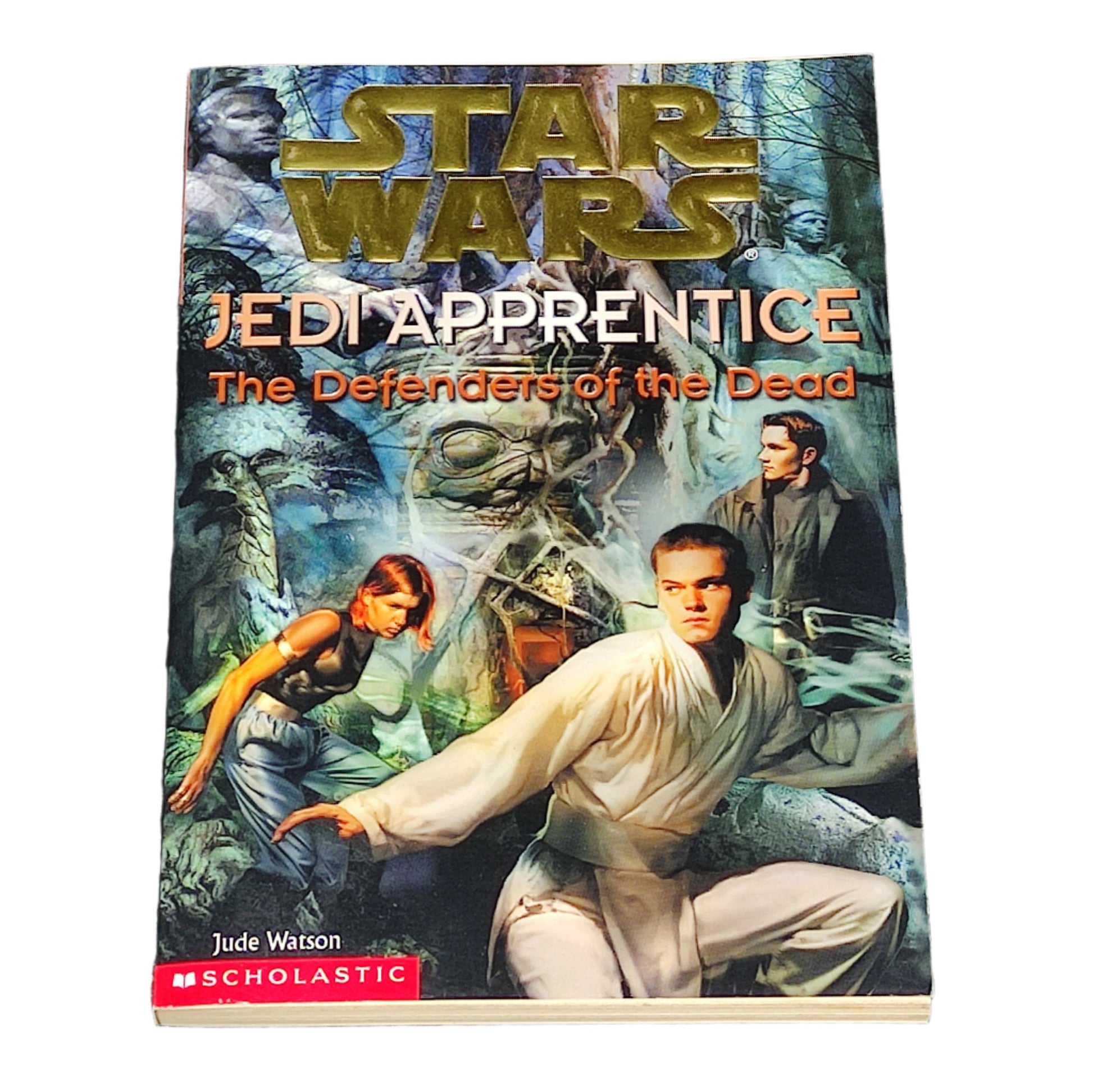 Book titled 'Star Wars Jedi Apprentice: The Defenders of the Dead' on a textured black background
