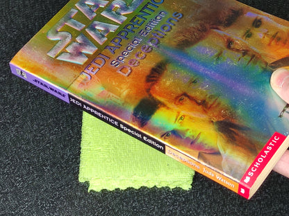 Star Wars Jedi Apprentice Special Edition book held by a hand with a green cloth underneath.