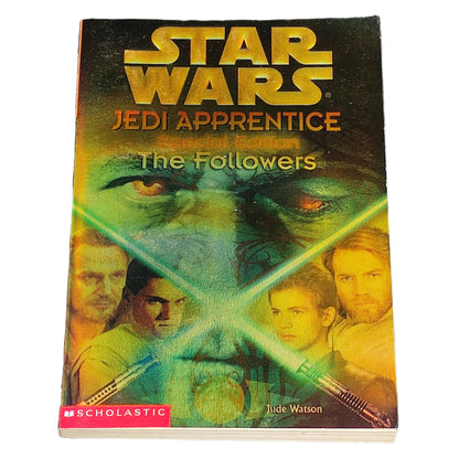 Book titled 'Star Wars Jedi Apprentice: The Followers' by Jude Watson on a textured black surface