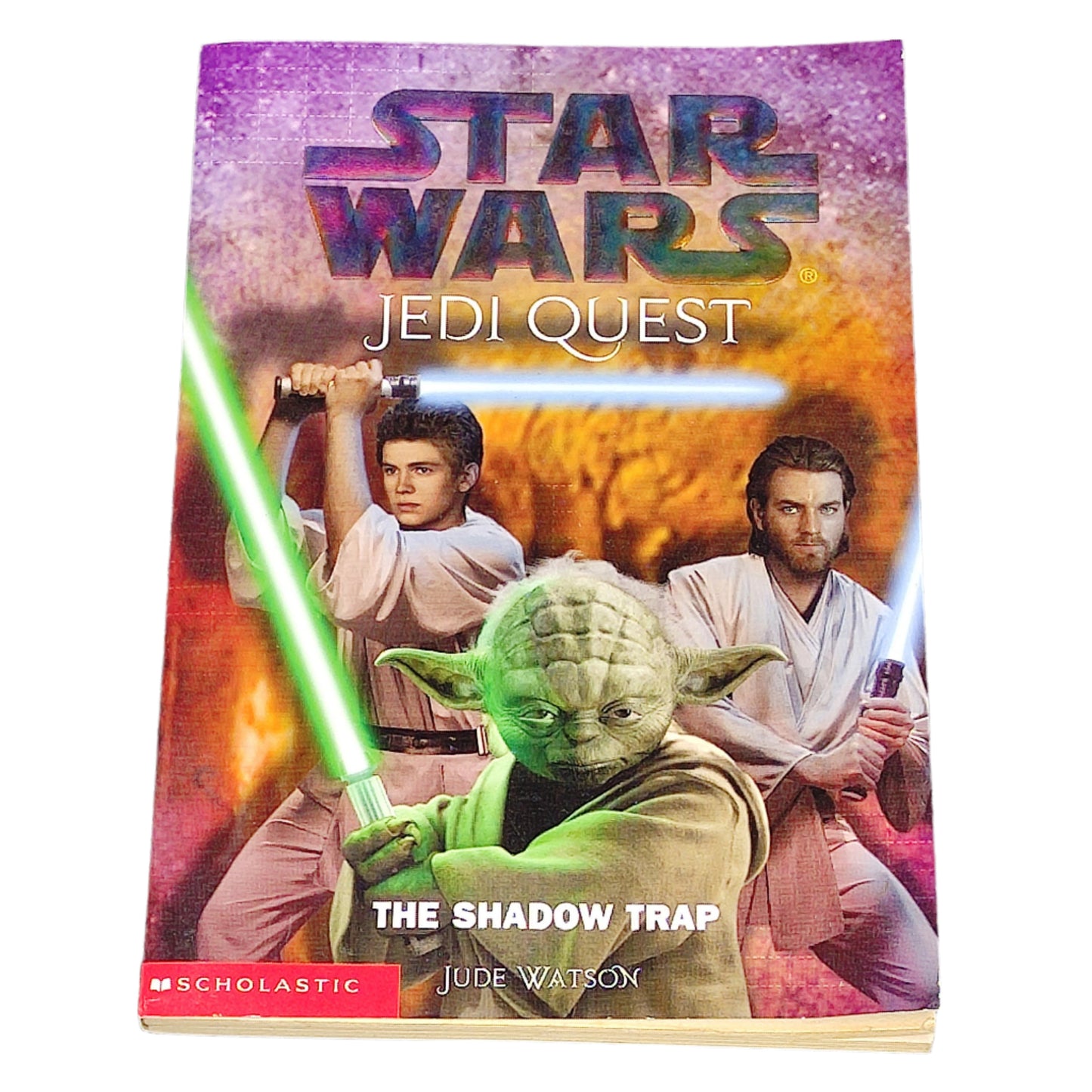 Book cover of 'Star Wars Jedi Quest: The Shadow Trap' featuring characters with lightsabers on a dark textured background.