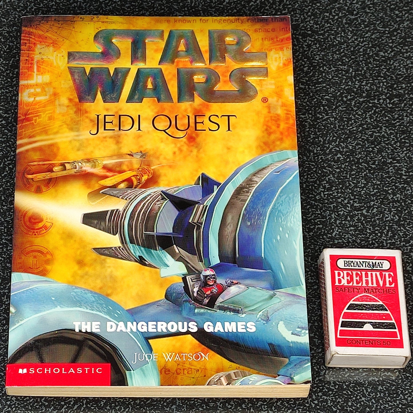 Star Wars Jedi Quest book with a toy car on a textured surface