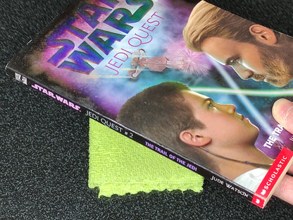 Star Wars Jedi Quest book with a green cloth on a dark surface