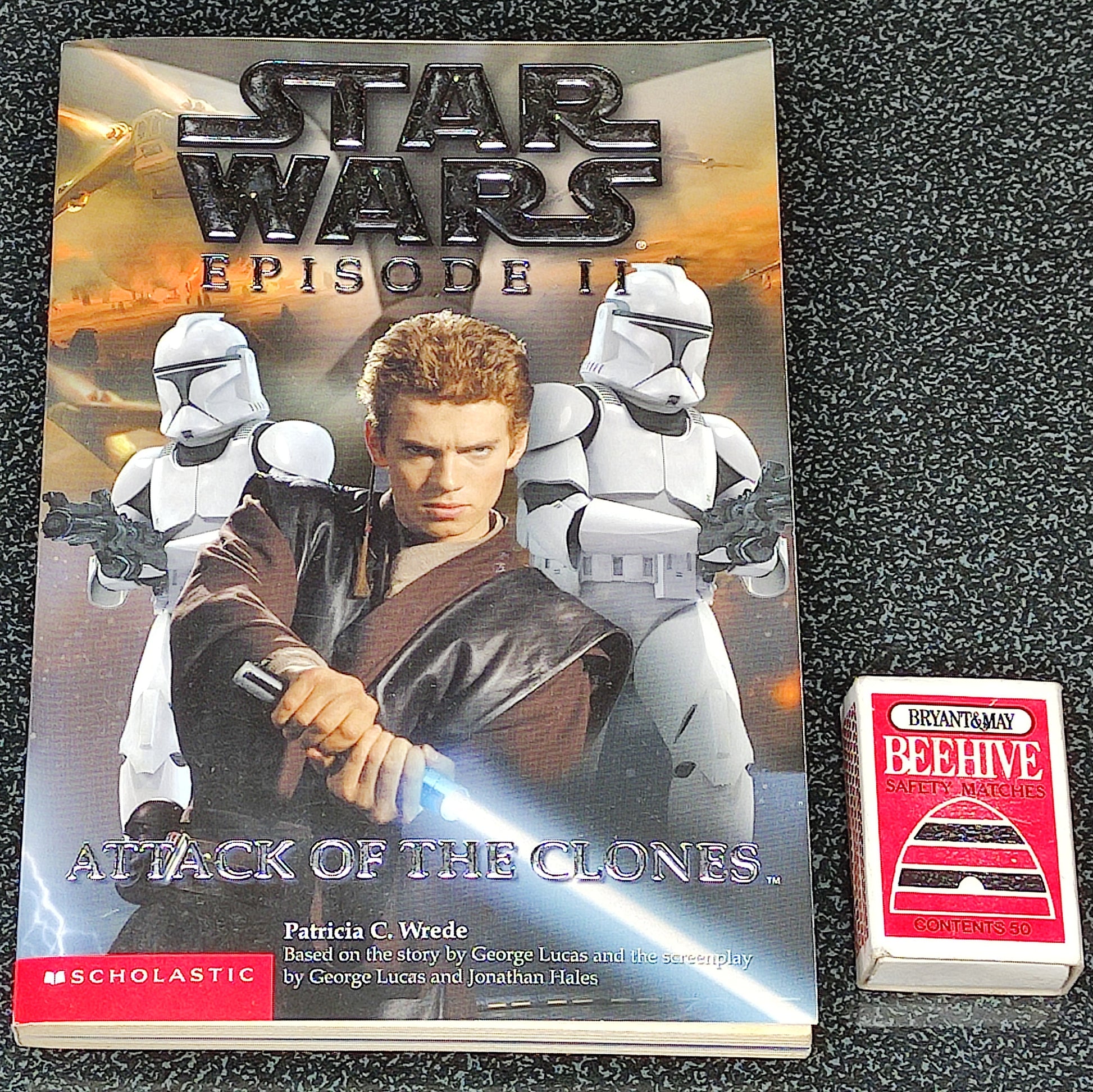 Star Wars book titled 'Attack of the Clones' with stormtroopers on a textured surface