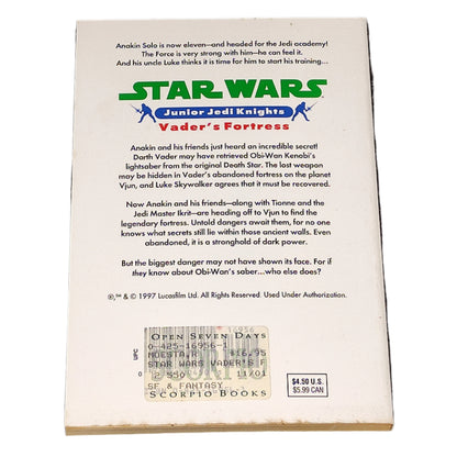 Back of a 'Star Wars' Junior Jedi Knights book titled 'Vader's Fortress' on a textured black surface.