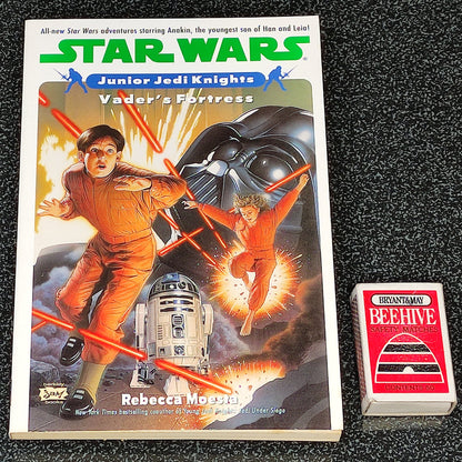 Star Wars book titled 'Vader's Fortress' by Rebecca Miller on a dark textured surface.