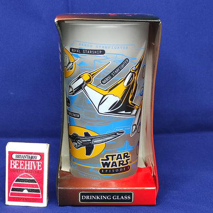Star Wars-themed drinking glass in packaging on a blue background