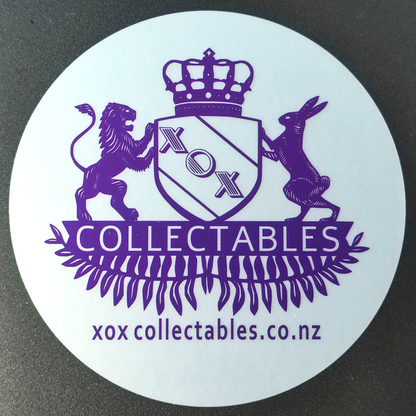 XOX Collectables Coat of Arms Sticker. Purple on reflective matte silver stuck on a Laptop