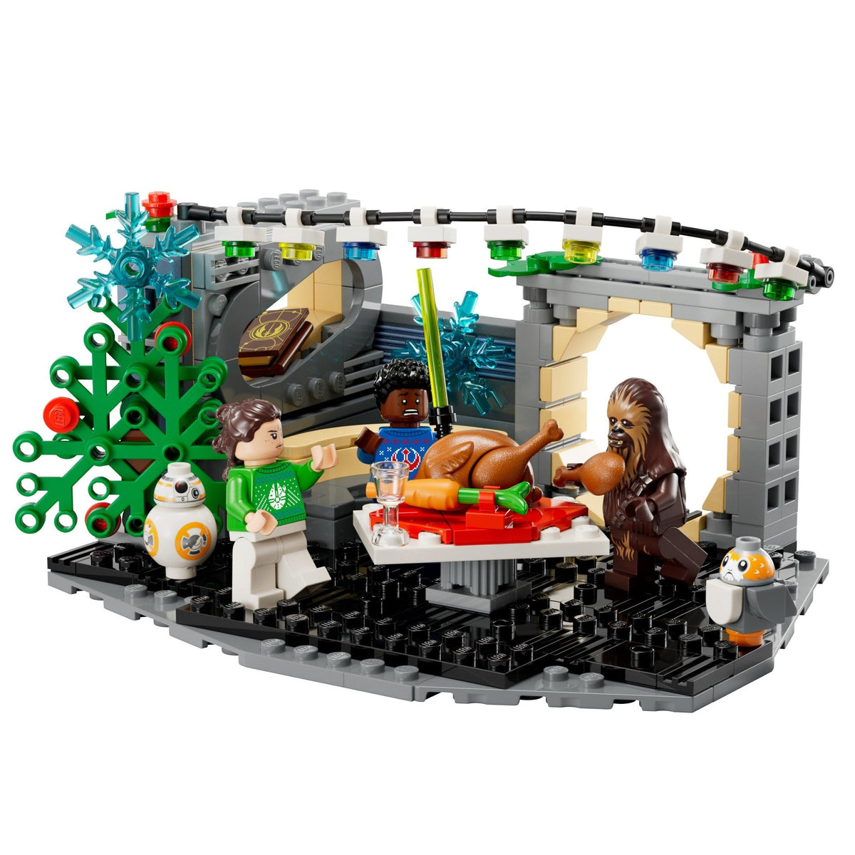 A LEGO Star Wars holiday-themed diorama set featuring characters Chewbacca, Luke Skywalker, and BB-8 along with a Christmas tree, turkey, and snowy outdoor scene on a gray baseplate, photographed against a solid white background.